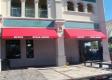 Awnings provide decorative functional storefront advertising. Serving Polk County Including Okahumpka FL 
34762